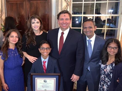 Essay contest winner Aidan Patel, other winners and Gov. DeSantis 